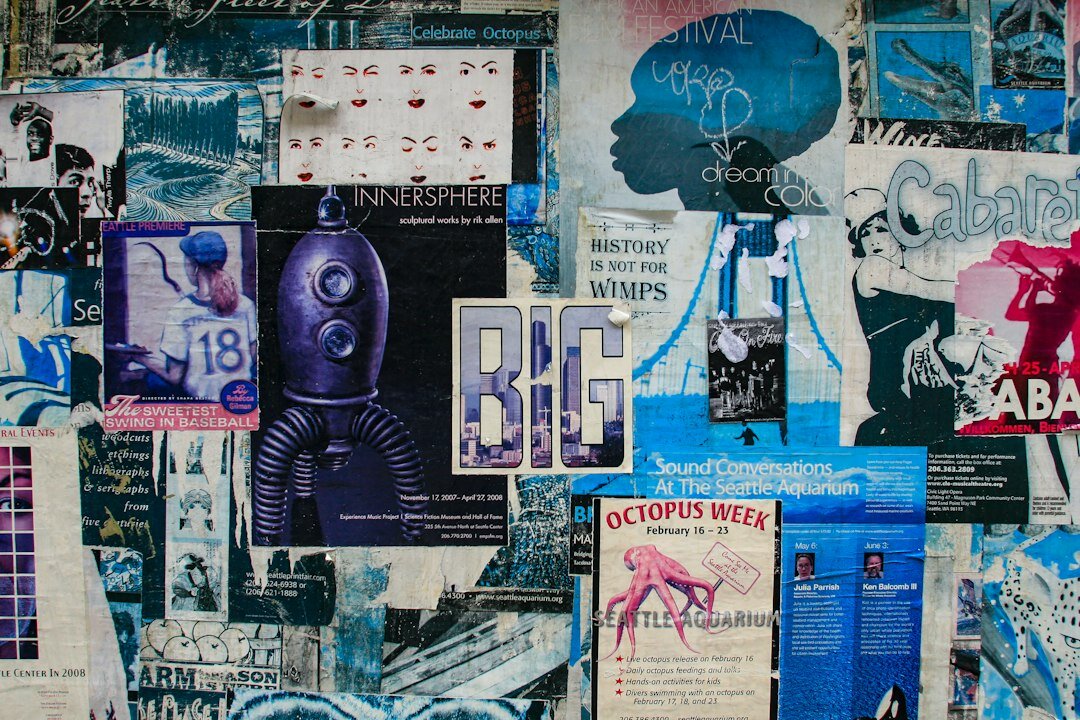 Colorful vintage advertising posters covering a wall